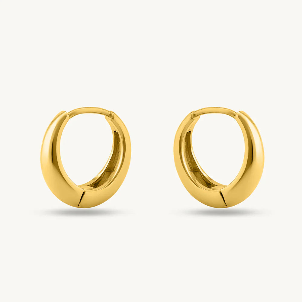 Gold hoop earrings on a white background